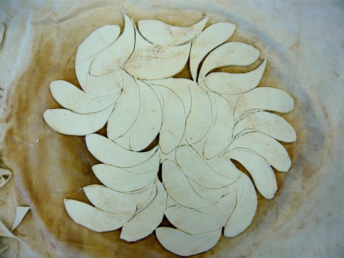 Porcelain fish forms cut from a paper-clay sandwich with newspaper, which can be added to other forms and structures